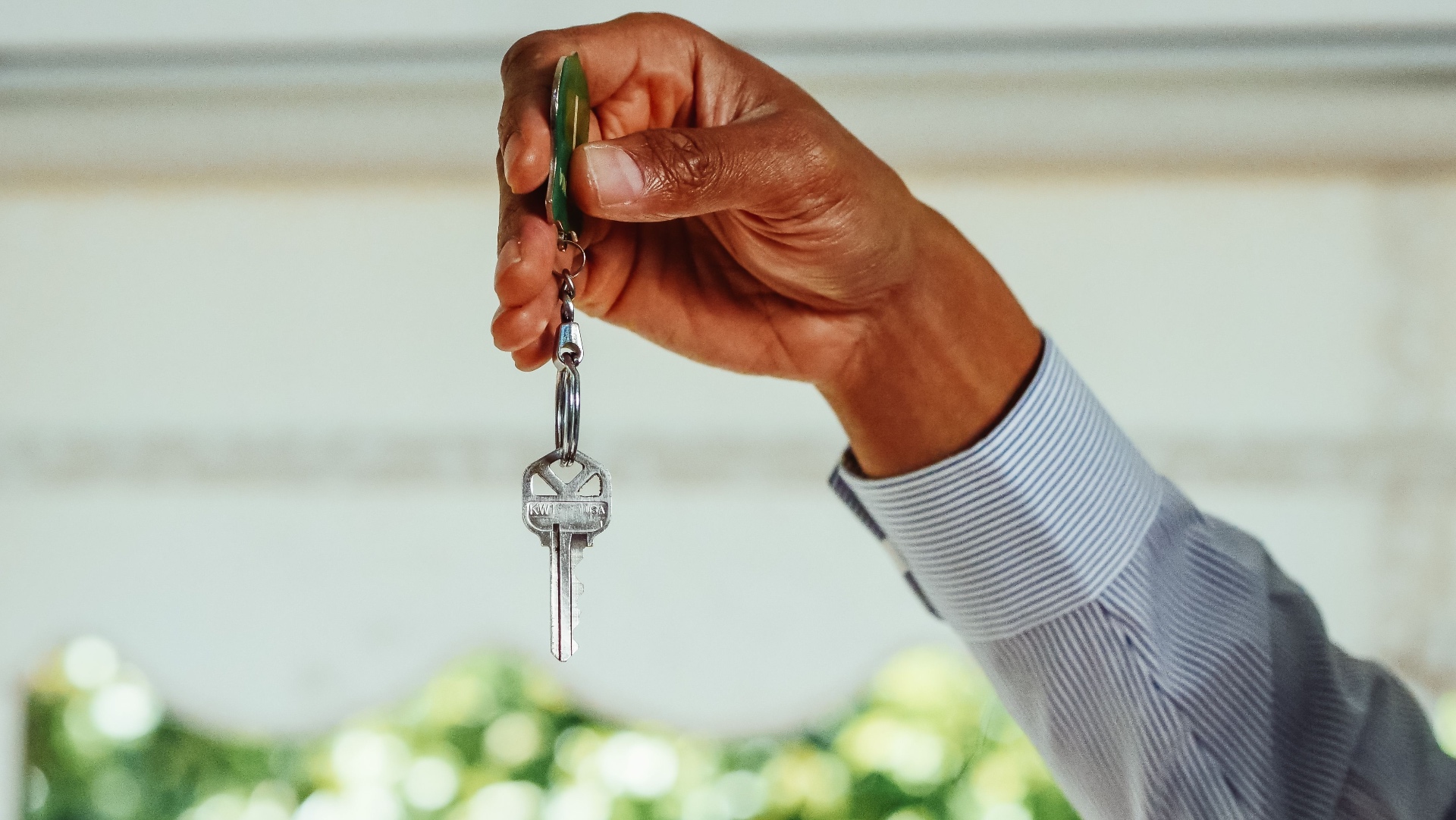 Agent at work — handshake, signing, or showing a property