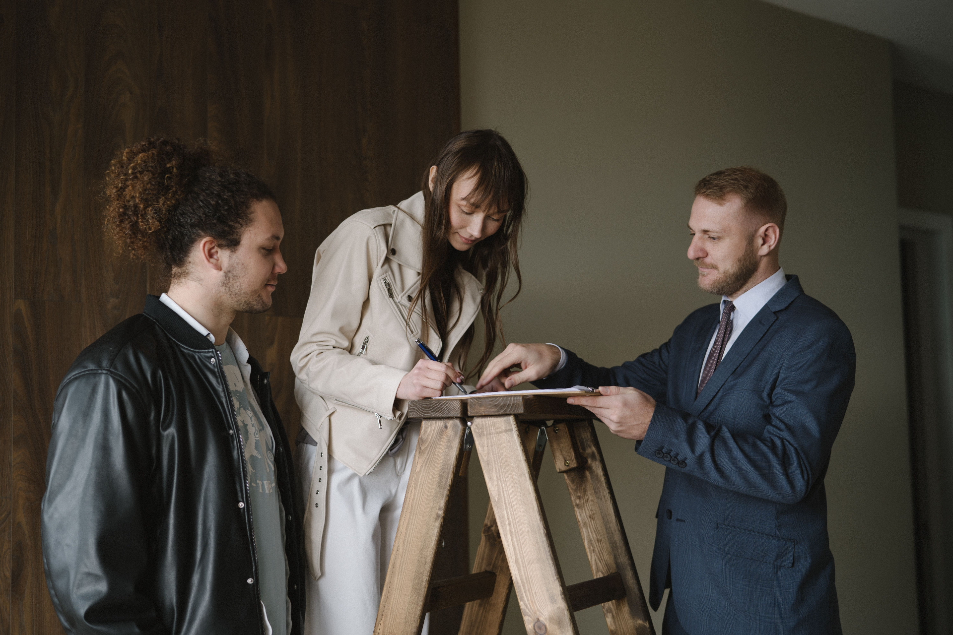 A handover moment — keys, signature, or new front door